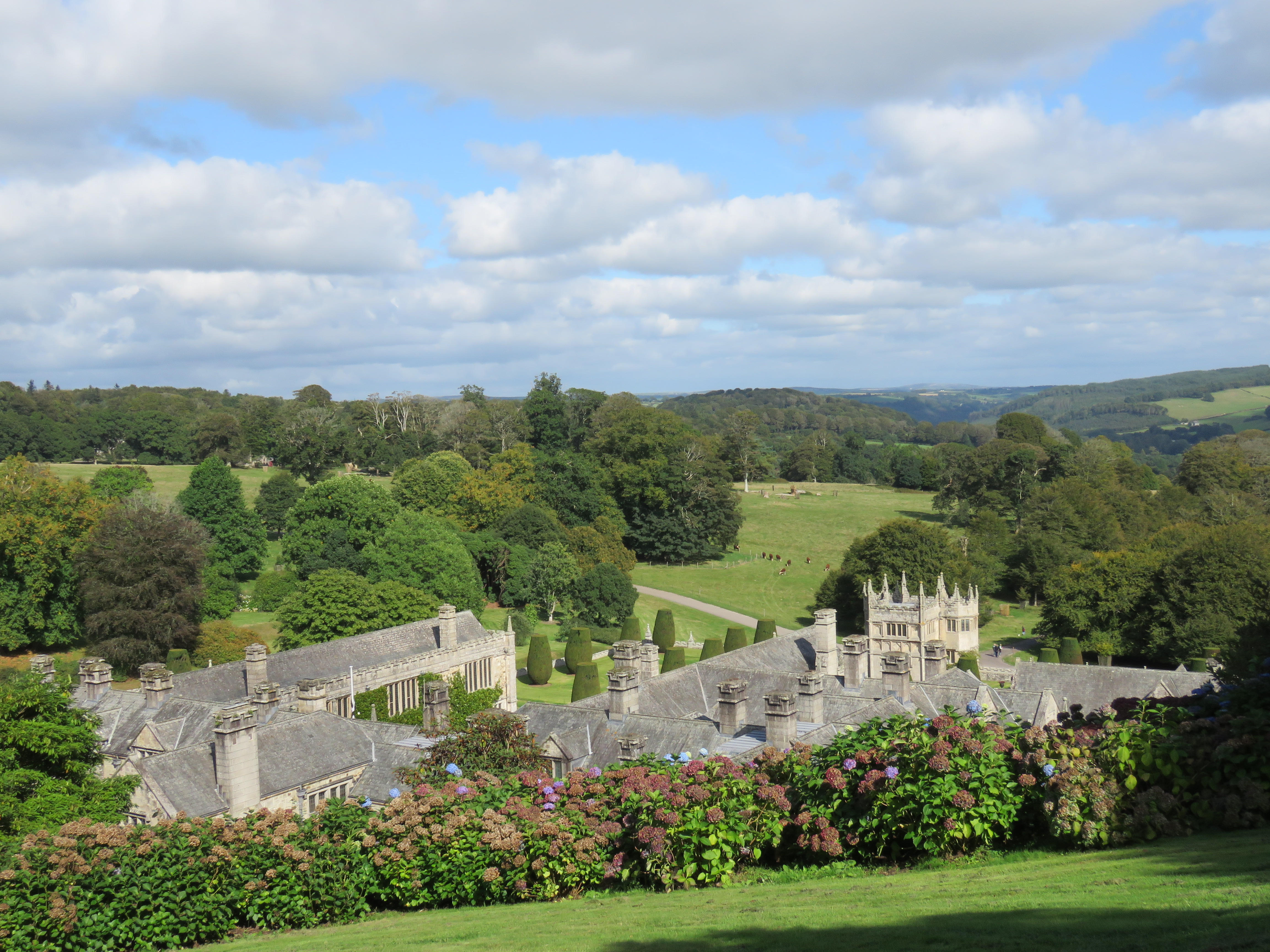 View across Lanhydrock House and surrounding countrysidefrom the upper reaches of the gardens.